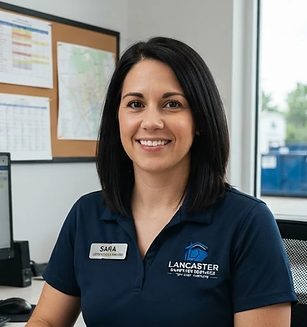 Sara, Lancaster Dumpster Services dispatcher, taking a booking in the office